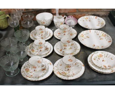 A VINTAGE CHINA TEASET TO INCLUDE CAKE PLATES, A SUGAR BOWL, CREAM JUG, CUPS, SAUCERS, SIDE PLATES, PLUS WINE GLASSES AND DES