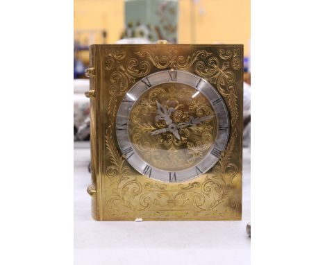 A VERY HEAVY VINTAGE BRASS/BRONZE HAND ENGRAVED DECORATIVE FRENCH MECHANICAL MANTLE CLOCK IN THE FORM OF A BOOK.  WITH KEY, W