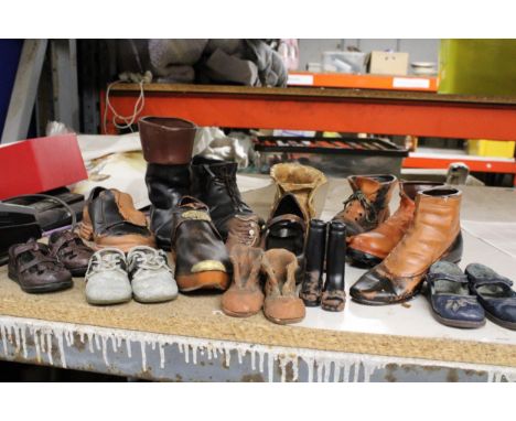 A QUANTITY OF CLAY AND CERAMIC SHOE ORNAMENTS