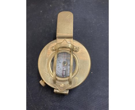 A BRASS SUNDIAL AND COMPASS