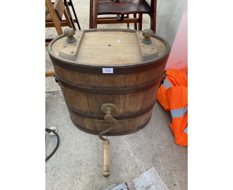 A VINTAGE WOODEN AND METAL BANDED BUTTER CHURN