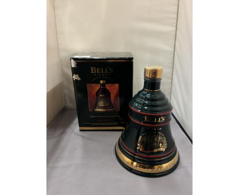 A BOXED AND SEALED BELL'S FINEST OLD SCOTCH WHISKY CHRISTMAS 1992 IN A WADE PORCELAIN CHRISTMAS DECANTER FINISHED IN 22 CARAT