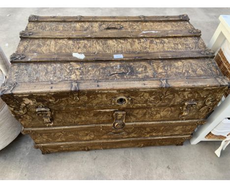A LATE VICTORIAN TRAVELLING TRUNK WITH METALWARE LATCHES AND HARDWARE AND LEATHER CARRYING HANDLES, 34" X 21"