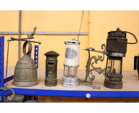 TWO VINTAGE MINERS LAMPS, A BRASS BRACKET, A HEAVY BRASS BELL AND A BRASS POSTBOX MONEY BOX
