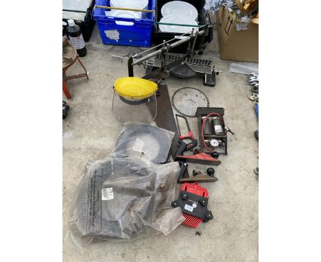 AN ASSORTMENT OF TOOLS TO INCLUDE A FOOT PUMP, TWO WOOD PLANES AND A MITRE SAW ETC