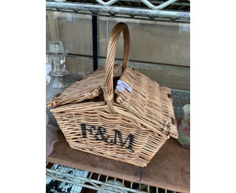 A SMALL WICKER F&amp;M HAMPER BASKET
