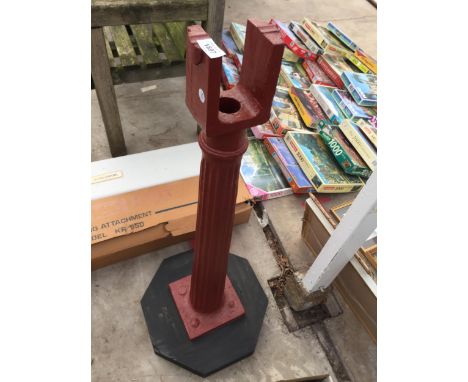 A DECORATIVE CAST IRON PILLAR STAND