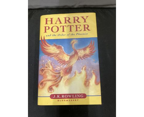 A FIRST EDITION HARRY POTTER AND THE ORDER OF THE PHOENIX HARD BACK BOOK WITH DUST COVER IN GOOD CONDITION