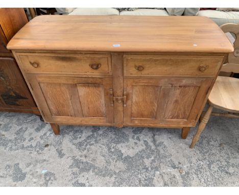 A MID CENTURY ERCOL DRESSER BASE ENCLOSING TWO DRAWERS AND TWO CUPBOARDS