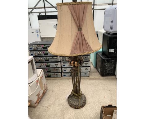 A DECORATIVE METAL TABLE LAMP WITH SHADE