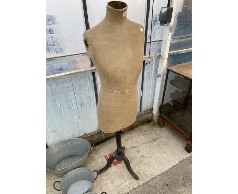 A VINTAGE DRESS MAKERS MANNEQUIN WITH WOODEN STAND