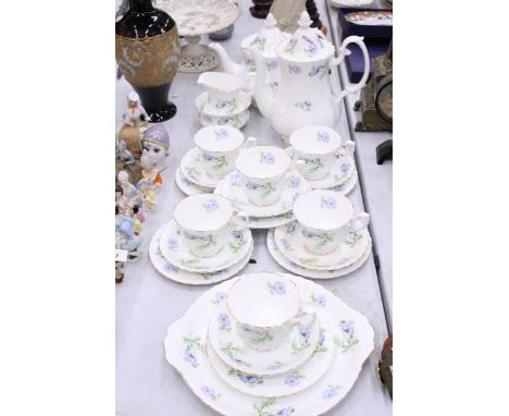 A RICHMOND BLUE POPPY TEASET TO INCLUDE CUPS AND SAUCERS, SIDE PLATES, TEAPOT, MILK, SUGAR, CAKE PLATE AND TO ALSO INCLUDE A 