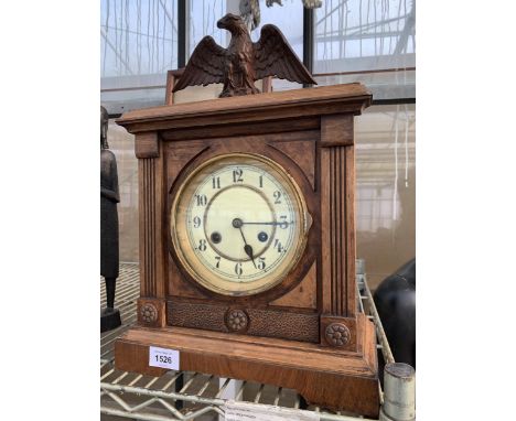 A MAHOGANY CHIMING MANTLE CLOCK WITH EAGLE TOPPER