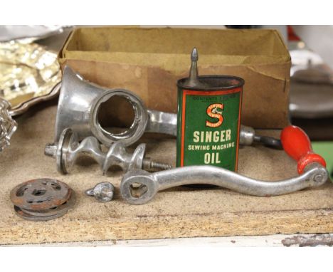 A METAL MEAT GRINDER AND SEWING MACHINE OIL