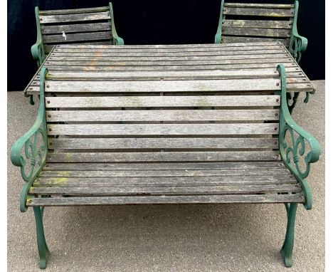 A heavy cast iron and wooden slatted garden table, bench, two chairs and stool, 155cm wide, 68.5cm deep, 66cm high**Please no