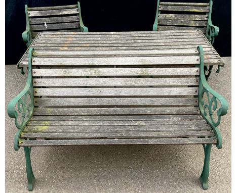 A heavy cast iron and wooden slatted garden table, bench, two chairs and stool, 155cm wide, 68.5cm deep, 66cm high**Please no