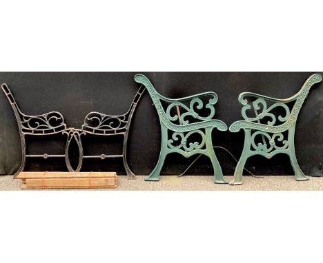 A pair of cast iron garden bench ends; another pair similar with loose wooden slats (4)**Please note that some of the lots in