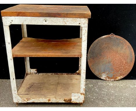 A two tier work bench, 85cm high, 65cm wide;  a cast iron circular plate, 53cm diam (2)**Please note that some of the lots in