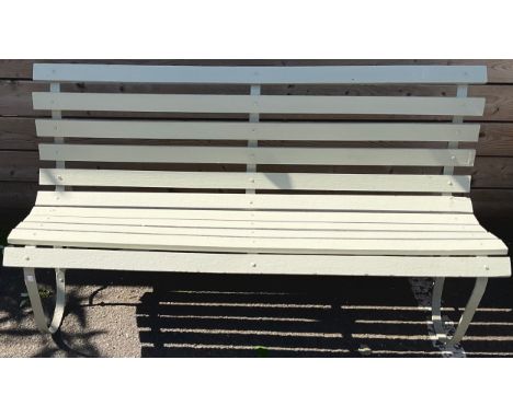 A Victorian style wrought iron garden bench, scrolling legs, wooden slats, 83cm high, 152cm long**Please note that some of th