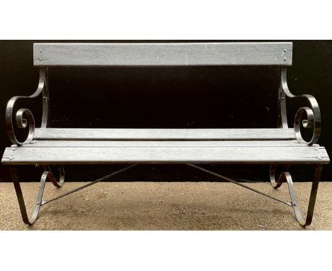 A cast iron and wooden slatted garden bench, 133cm wide**Please note that some of the lots in this auction are held offsite a