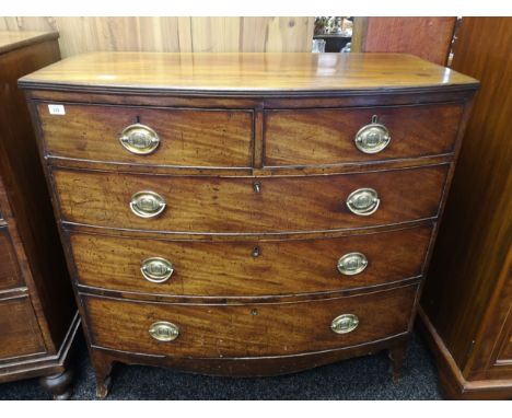 Georgian/ Victorian bow-front chest of drawers, two small drawers above three long drawers, with brass swing handles, raised 