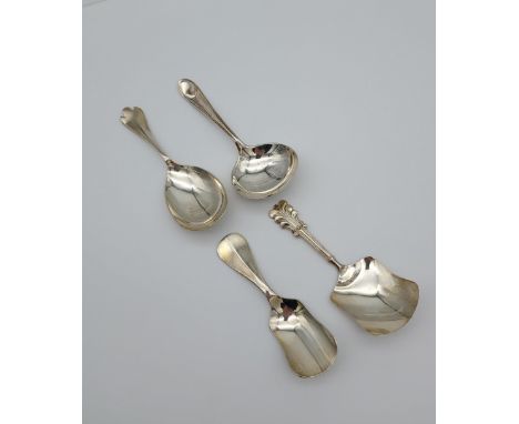 A Lot of four Silver Caddy Spoons to include Two Birmingham and Two Sheffield silver. [52.88grams] 