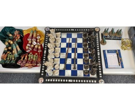 The Noble Collection Harry Potter Final Battle Chess Set. Movable chess pieces using wands. Comes with dragon goblet of fire 