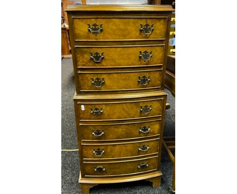 Burr-walnut chest on chest, three shorter drawers above four longer drawers detailed with swing handles, supported on bracket