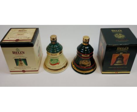 Two vintage Bell's Christmas Old Scotch Whisky decanters, 1994 &amp; 1998. Full, sealed and boxed. 