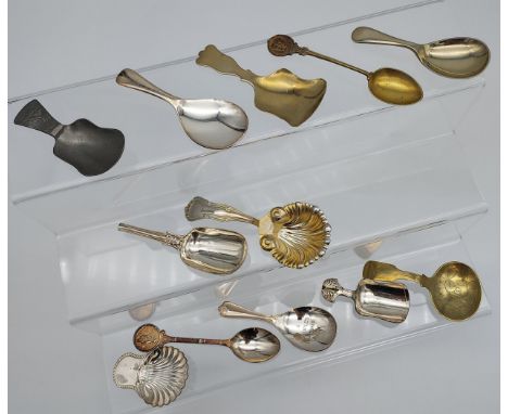 A Selection of caddy spoons to include Gilt foreign silver marked spoon in a shell form 