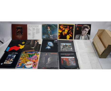 A Record case containing various records. Pink Floyd- The Wall, Nik Kershaw, Genesis, Nena, Frankie goes to Hollywood, AC DC,