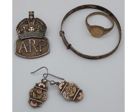 A London silver A.R.P. Badge, silver baby bangle, silver earrings and 9ct &amp; silver signet ring. 