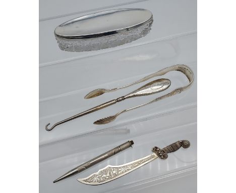 A Selection of silver items to include Victorian Edinburgh sugar tongs, silver handle button hook, Foreign silver marked dagg
