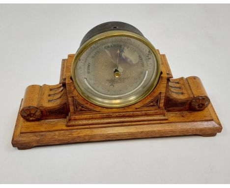 Antique Table top barometer produced by an Edinburgh maker. Fitted within a carved wooden base. 