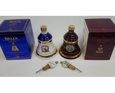 Two Vintage Bell's whisky decanters full, sealed and boxed. Includes The great Scottish inventors bell and two whisky pourers