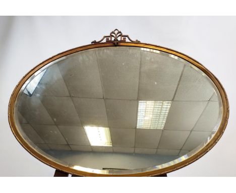 A 19TH Century regency style metal framed mirror, in an oval form. [60x78cm] 