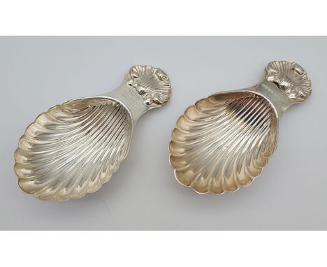 Two Birmingham silver caddy spoons, scalloped designs. [8cm in length] [42.19grams] 