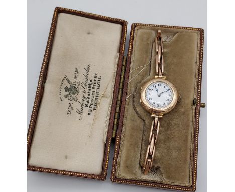 A 9ct gold vintage ladies watch with a 9ct gold elasticated strap and comes with original Mackay &amp; Chisholm box. [13.8gra