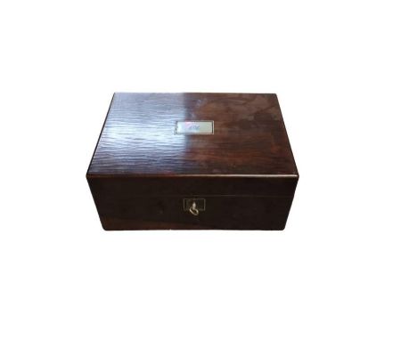 A Victorian rosewood jewellery box the lid inlaid with mother of pearl plaque engraved with initials, the inside fitted with 