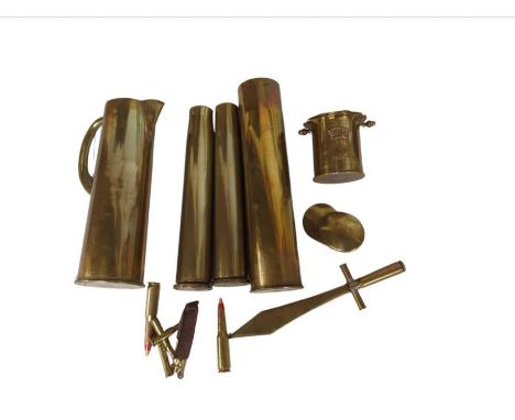 A quantity of WWI period trenchart including a brass snuff box in the form of an officer’s cap, a cigarette lighter, tall she