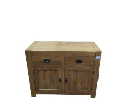 A modern light oak side cabinet fitted with two deep short drawers above pair of doors enclosing shelved cupboard, 86cm high 