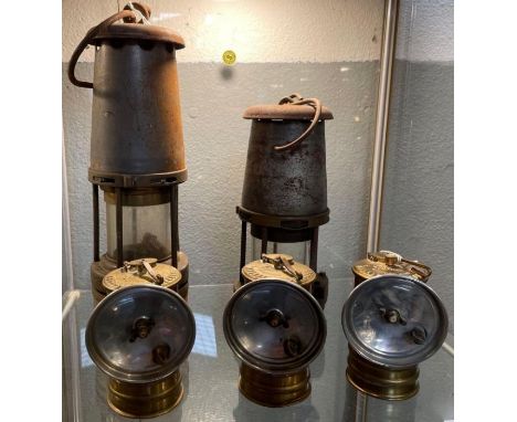 A miner’s lamp The Wolf Safety Lamp 27cms high with hook together with another similar smaller lamp 21cms high with hook and 