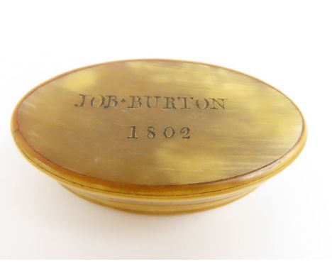 An early 19th Century oval cows horn snuff box engraved “Job Burton 1802” 8cms wide