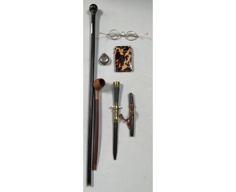 A silver topped ebonised wood swagger stick; 58cms long;  a Victorian tortoiseshell card case; a paper knife modelled as a ba