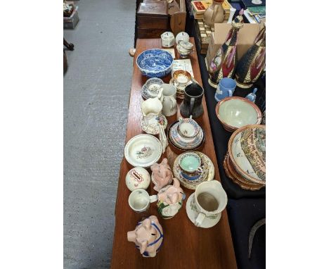 A quantity of assorted china including Wade Nat West Piggy Banks, Spode part porcelain tea service, other porcelain tea cups 