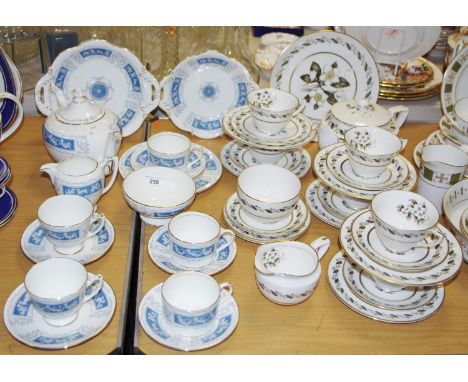 A Royal Worcester Bernina pattern part tea service comprising a tea pot, teacups &amp; saucers, side plates, milk jug, sugar 