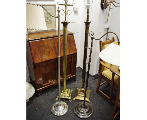 A brass standard lamp with Corinthian column; another; a modern telescopic standard lamp; another modern standard lamp (4) 