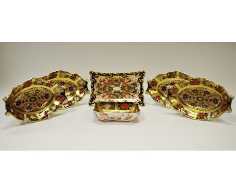 Royal Crown Derby - four 1128 trinket dishes; a rectangular 1128 trinket dish; a rectangular 2451 trinket dish (6) all first 