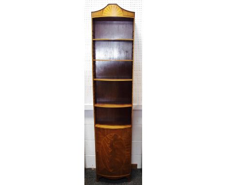 A reproduction mahogany bookcase cabinet of slender proportions, adjustable shelving, over bow front cupboard, 201cm high, 43