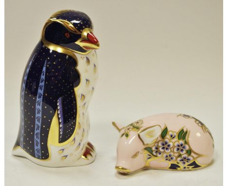 A Royal Crown Derby limited edition paperweight, Rock Hopper Penguin; another Plumbstead Piglet, each boxed with certificates